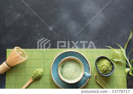 Ceremony organic green matcha tea on black table. 53776727