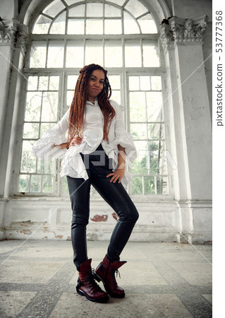 dreadlocks fashionable girl dressed in white shirt 53777368
