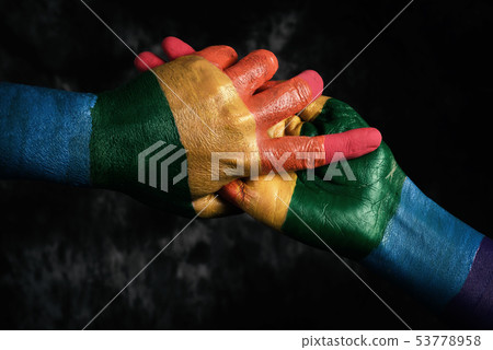 men holding hands patterned with the rainbow flag men holding hands patterned with the rainbow flag 53778958
