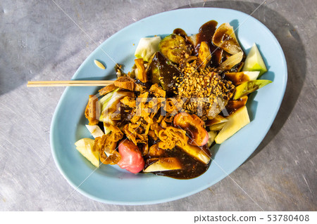Popular Penang fruit rojak served with prawn paste 53780408