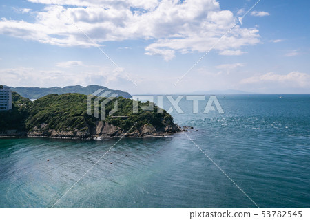 The magnificent view of the Great Naruto Bridge from Sonozaki Observatory, encompassing the whirlpools of the Naruto Strait and the lighthouse. 53782545