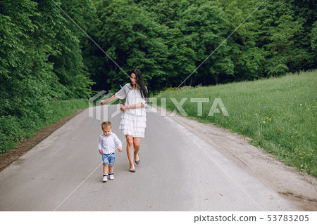 Mother with son playing in a summer park 53783205