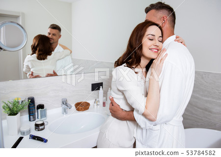 Waist up of a loving couple hugging in the - Stock Photo