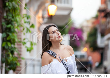 Beautiful woman at the streets of the walled city Beautiful woman at the streets of the walled city 53785111