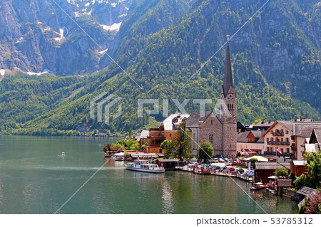 Famous Austria village Hallstatt with church 53785312