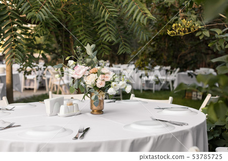 Wedding table setting decorated with fresh flowers Wedding table setting decorated with fresh flowers 53785725