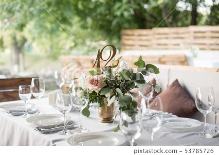 Wedding table setting decorated with fresh flowers Wedding table setting decorated with fresh flowers 53785726