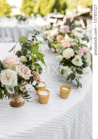 Wedding table setting decorated with fresh flowers Wedding table setting decorated with fresh flowers 53785727