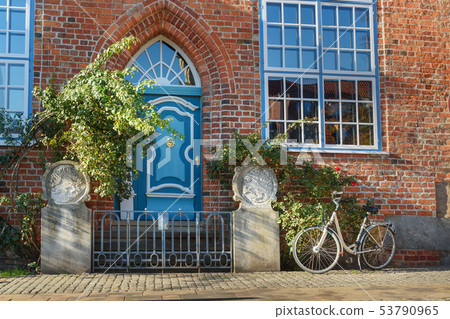Old blue wooden front door in house. Luneburg. 53790965