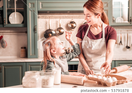 Attractive woman going to bake tasty cookies Attractive woman going to bake tasty cookies 53791878