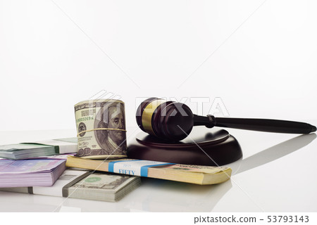 Judge's gavel and packs of dollars and euro 53793143