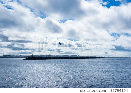 Okinawa Naha Port Asian Crossroads Breakwater Plane just before landing 53794194