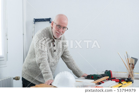 mature man doing DIY at home 53794979