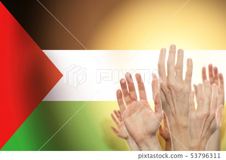 People raising hands and flag palestina 53796311
