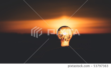 Light bulb in sunset. Photo from Finland. 53797363