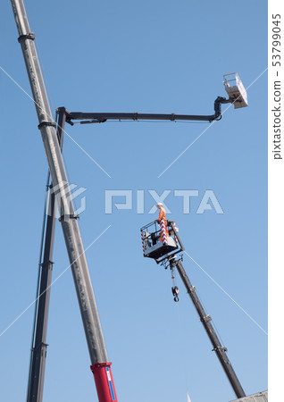 Electrician dummy in basket on cherry picker. Electrician dummy in basket on cherry picker. 53799045