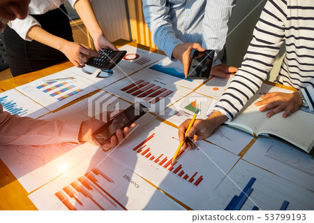 Businesspeople analyzing investment graph meeting Businesspeople analyzing investment graph meeting 53799193