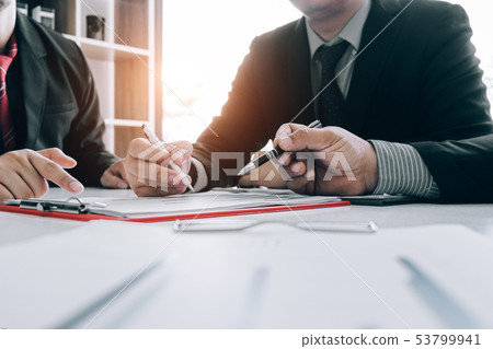 Business people analyzing investment graph meeting 53799941