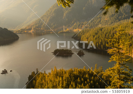 Sunset views of Diablo Lake surrounded by mountains, in North Cascades 53805919