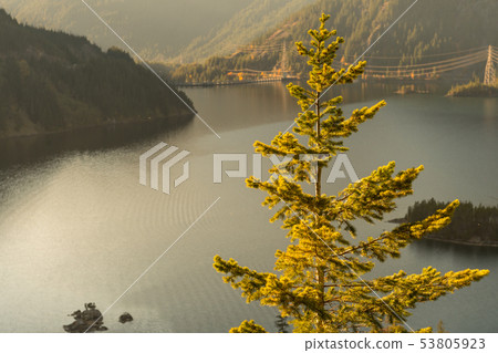 Sunset views of Diablo Lake surrounded by mountains, in North Cascades 53805923