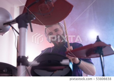 People, music and hobby concept - emotional man playing drums on the stage. 53806638