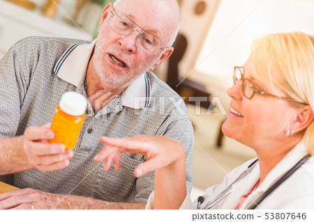 Doctor or Nurse Explaining Prescription Medicine 53807646