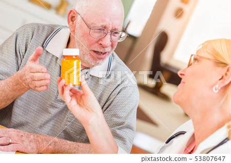 Doctor or Nurse Explaining Prescription Medicine 53807647