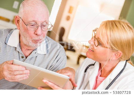 Female Doctor or Nurse Showing Senior Man Touch 53807728