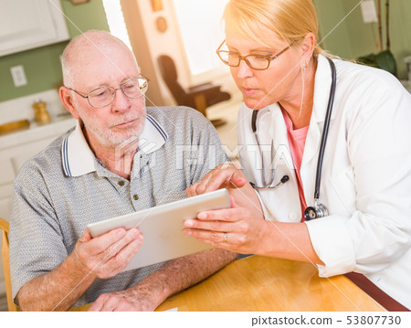 Female Doctor or Nurse Showing Senior Man Touch 53807730