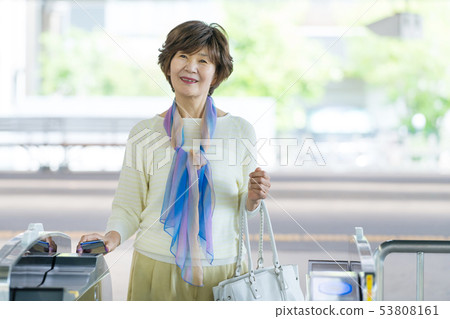 Senior woman station train commuting image photography cooperation: Keio Electric Railway Co., Ltd. Senior woman station train commuting image photography cooperation: Keio Electric Railway Co., Ltd. 53808161
