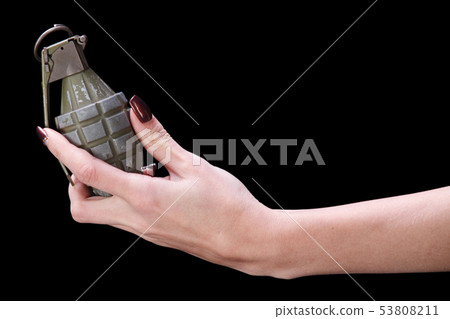hand grenade in girl hand 53808211