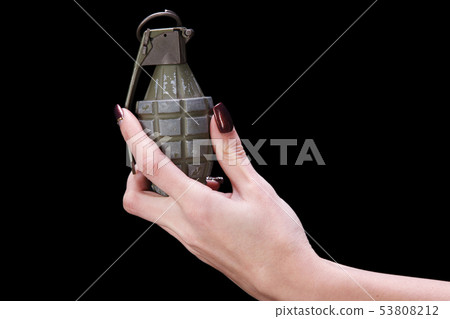 hand grenade in girl hand 53808212