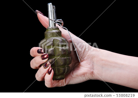 hand grenade in girl hand 53808219
