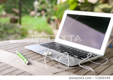 Laptop, garden background 53808346