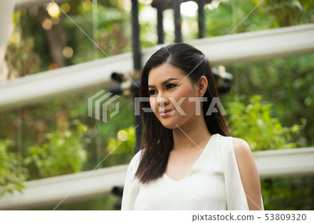 Woman white short dress sit in Herb restaurant Woman white short dress sit in Herb restaurant 53809320
