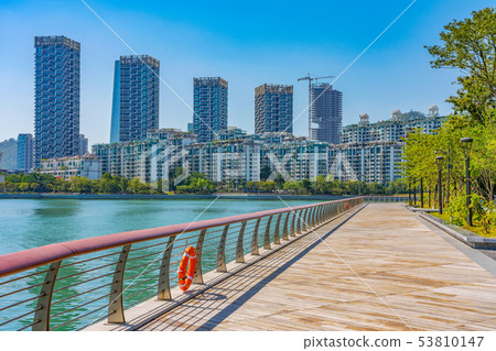 Seaside walking path and high rise apartments 53810147
