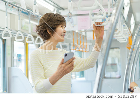 Senior woman Train Travel photography cooperation: Keio Electric Railway Co., Ltd. 53812287