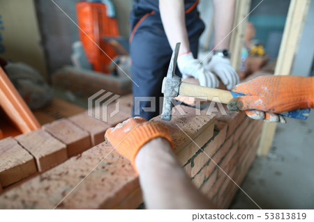 Skilled constructor with hammer Skilled constructor with hammer 53813819