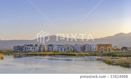 Buildings in Oquirrh Lake against mountain and sky 53814998
