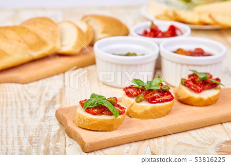 Bruschetta or crostini with sun dried tomatoes  53816225