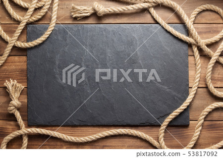 ship rope at wooden board background ship rope at wooden board background 53817092