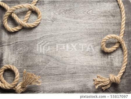 ship rope at wooden board background ship rope at wooden board background 53817097