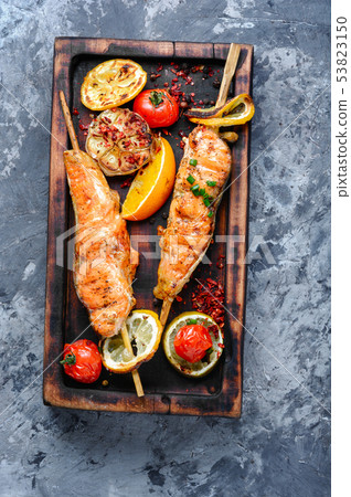 Grilled salmon on cutting board 53823150