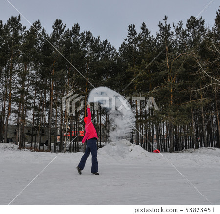 A tourist throwing hot water at winter park A tourist throwing hot water at winter park 53823451