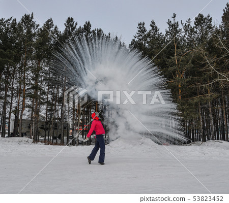 A tourist throwing hot water  at winter park 53823452