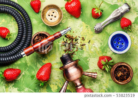 Smoking shisha on strawberry Smoking shisha on strawberry 53823519