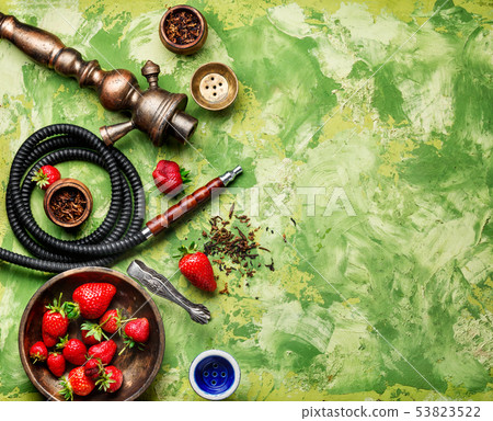 Smoking hookah on strawberry 53823522