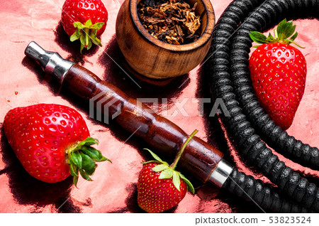 Smoking shisha on strawberry Smoking shisha on strawberry 53823524