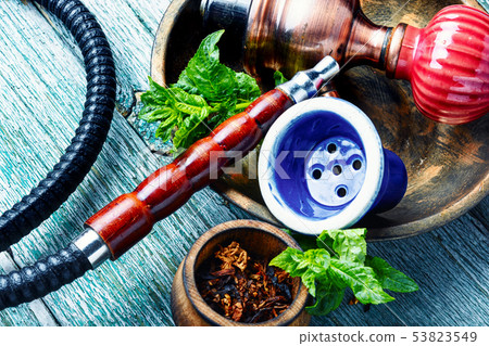 Smoking hookah with mint Smoking hookah with mint 53823549