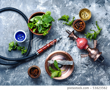 Smoking hookah with mint Smoking hookah with mint 53823562